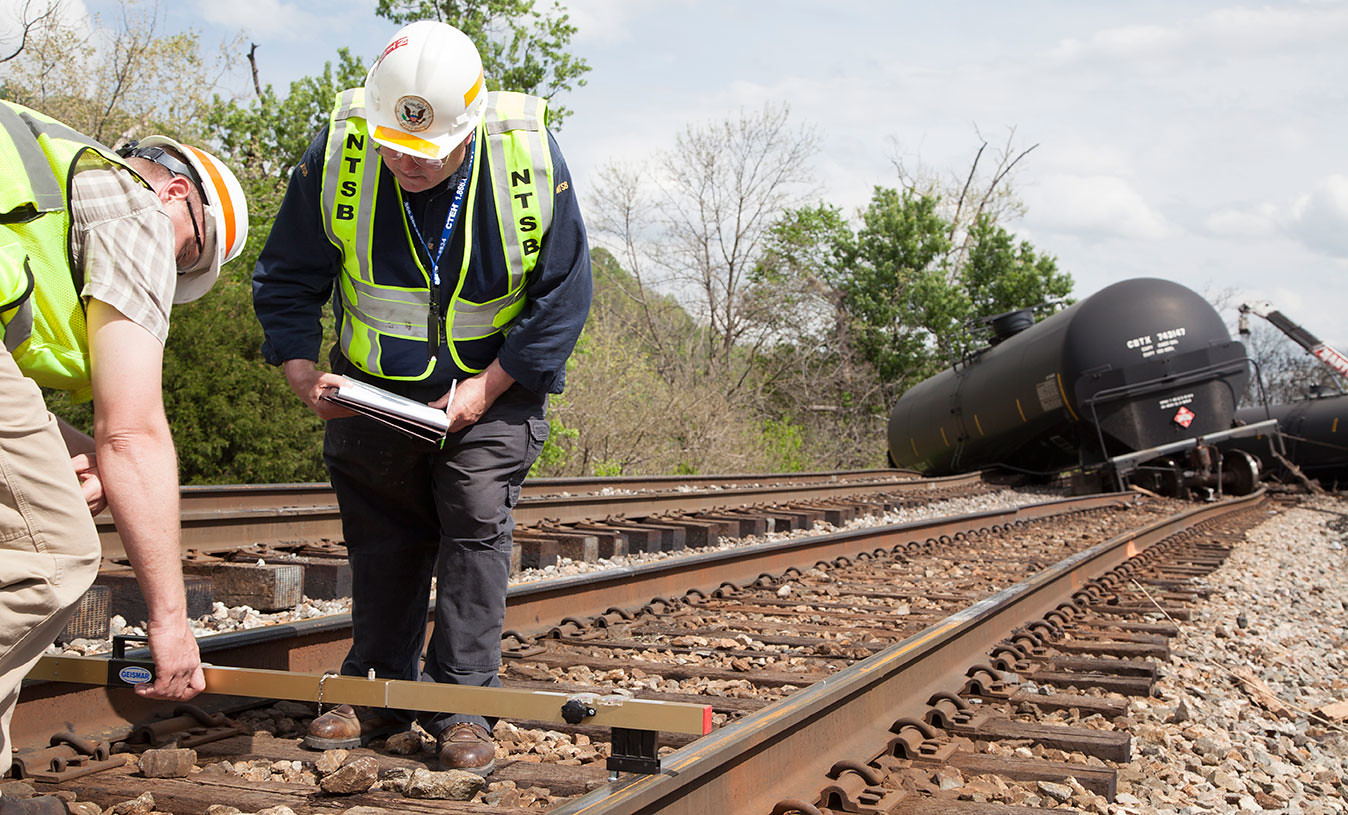 NTSB Rail Safety Investigators on scene in Lynchburg, VA NTSB rail investigator Richard Hipskind documents track damage on scene of train derailment in Lynchburg, VA. Photo by National Transportation Safety Board