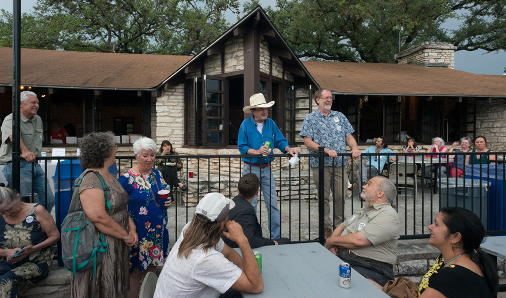 Jim Hightower and Texas Director David Foster address attendees. Jim Hightower and Texas Director David Foster address attendees.