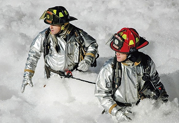 Firefighters surrounded by PFAS firefighting foam Firefighters surrounded by PFAS firefighting foam
