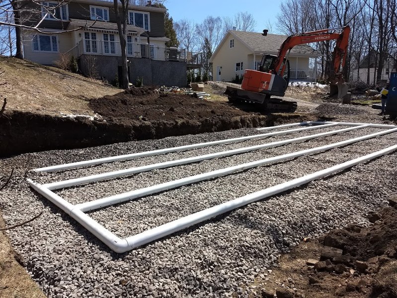 The drain field component of a residential septic system is being put in place. Creative Commons license The drain field component of a residential septic system is being put in place. Creative Commons license.