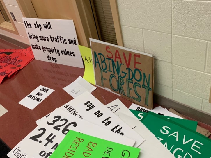 Photo of protest signs at public hearing. Courtesy of Patch.com Photo of protest signs at public hearing. Courtesy of Patch.com