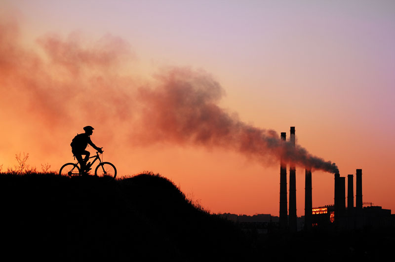 Sunset, powerplant, cyclist. Photo credit: Kalmatsuy / Shutterstock Sunset, powerplant, cyclist. Photo credit: Kalmatsuy / Shutterstock