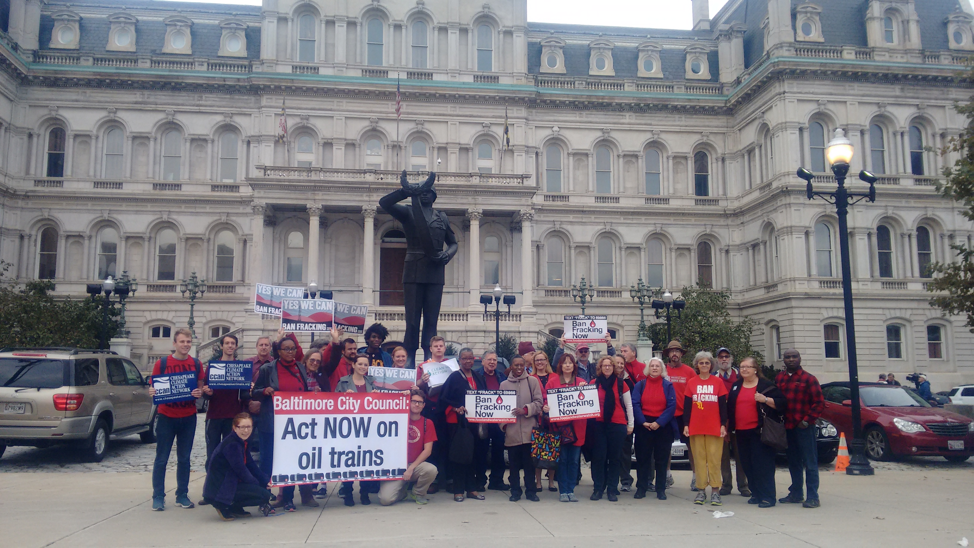 Over 30 Baltimore residents outside of City Hall wearing red in support of the Oil Trains Ordinance and the Fracking Ban Over 30 Baltimore residents outside of City Hall wearing red in support of the Oil Trains Ordinance and the Fracking Ban