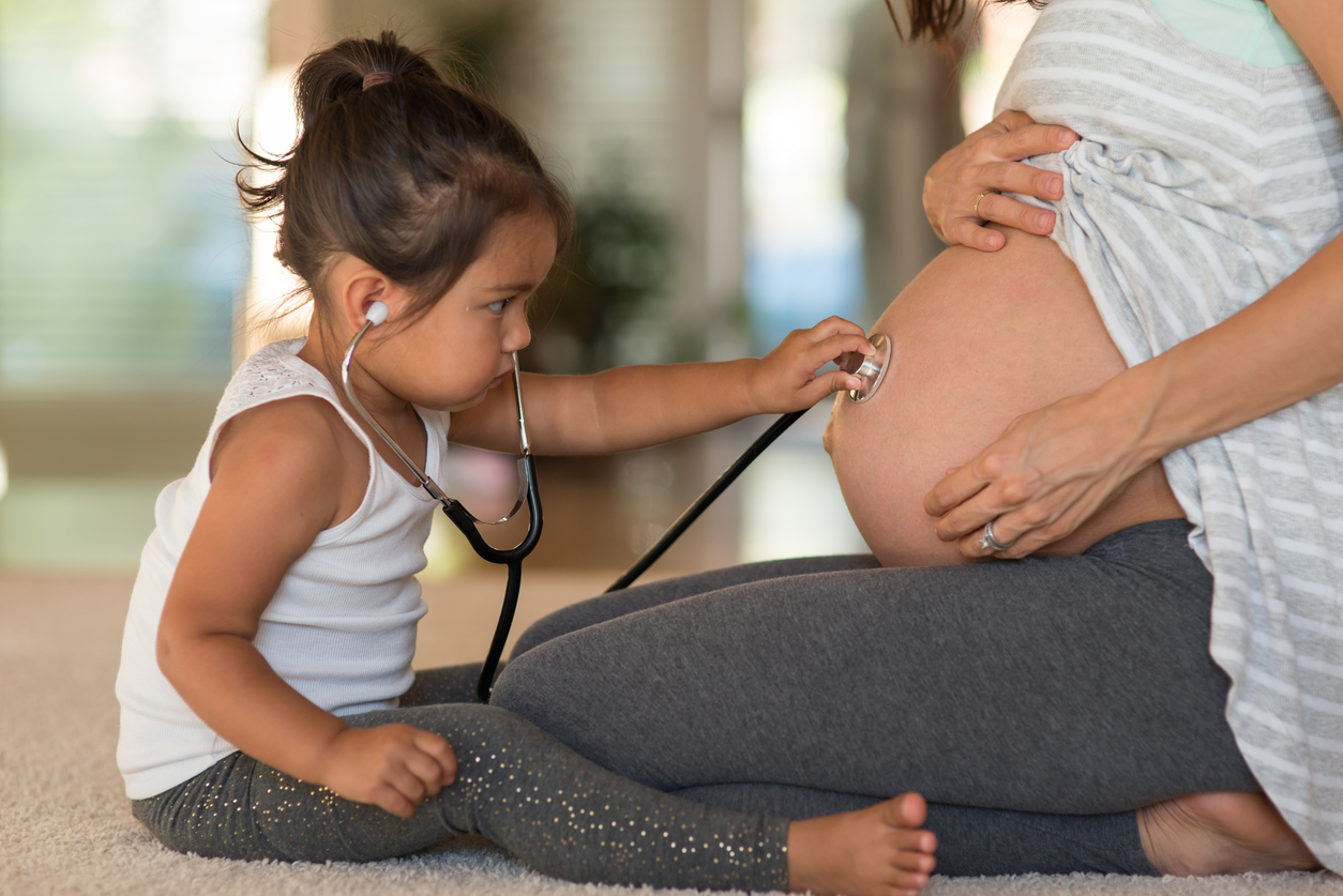 toddler with stethoscope listening to pregnant belly. photo: istock toddler with stethoscope listening to pregnant belly. photo: istock