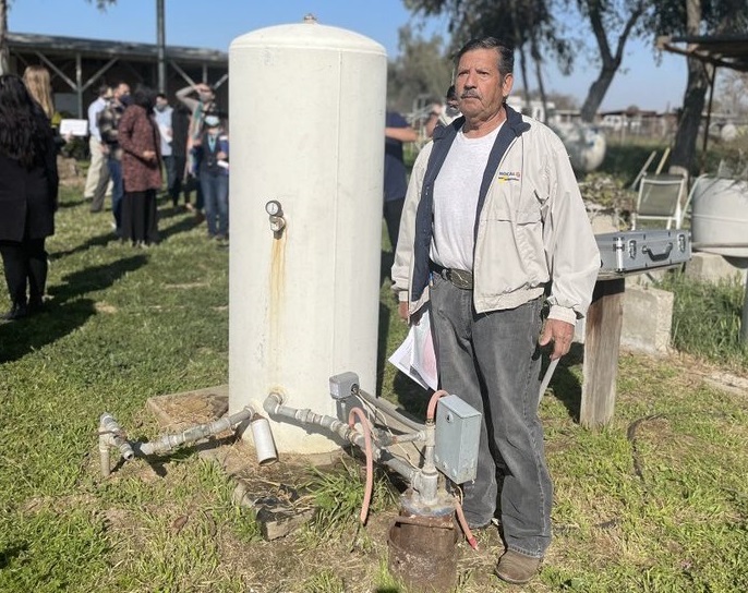 Community Water Tour in the San Joaquin Valley - Mr. Benitez next to his groundwater well Community Water Tour in the San Joaquin Valley - Mr. Benitez next to his groundwater well