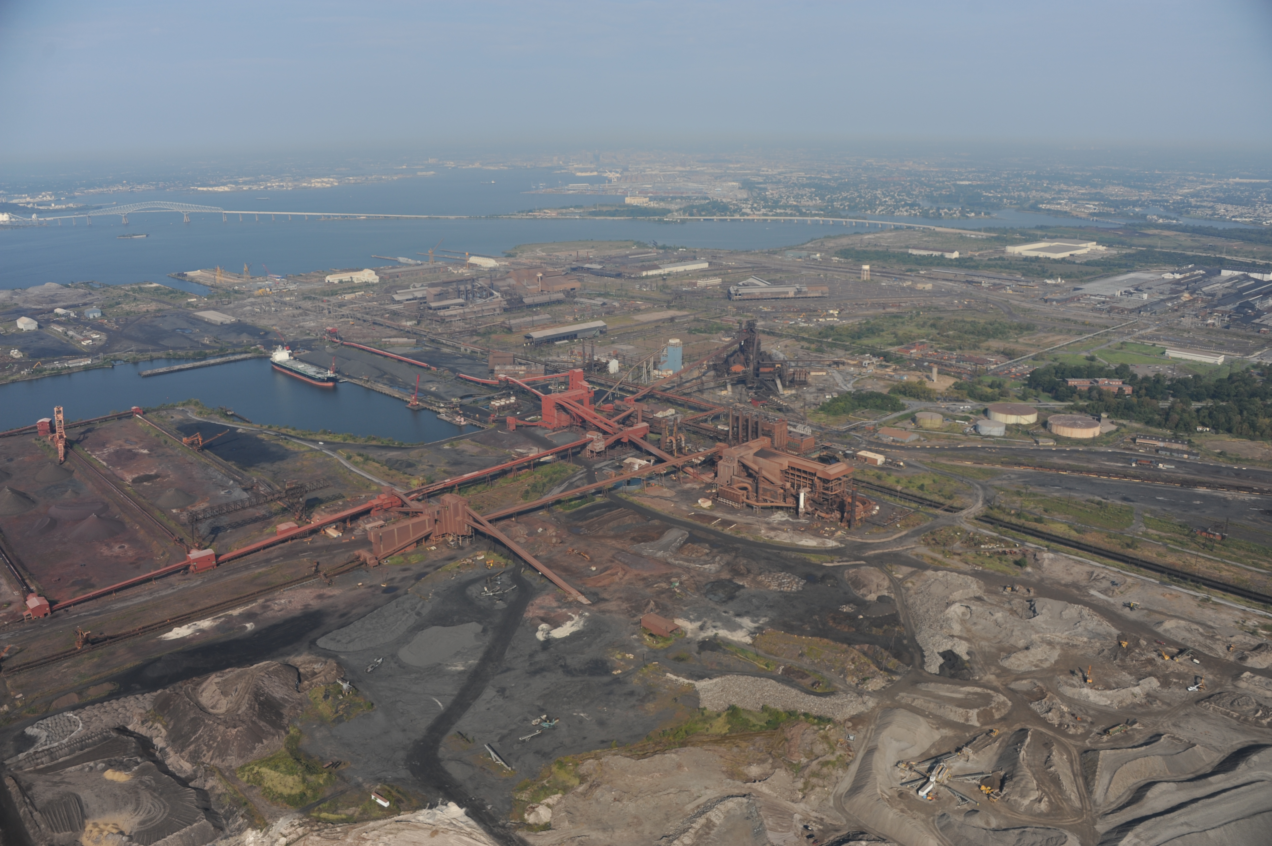 Sparrow's Point. Source: clui.org. Attribution-Noncommercial-Share Alike 3.0 Creative Commons License An aerial view of Sparrow's Point in Baltimore County, with the FSK Bridge and Baltimore City in the background.