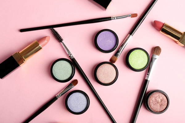 Cosmetics - lipstick, other makeup - arranged on a table Cosmetics - lipstick, other makeup - arranged on a table