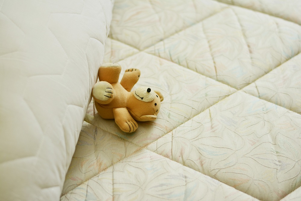 Mattress witha teddy bear on it Mattress witha teddy bear on it