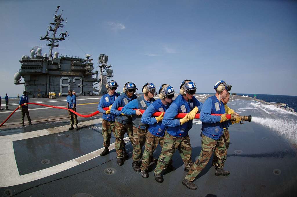 air department personnel wash aqueous film forming foam AFF off a plane air department personnel wash aqueous film forming foam AFF off a plane