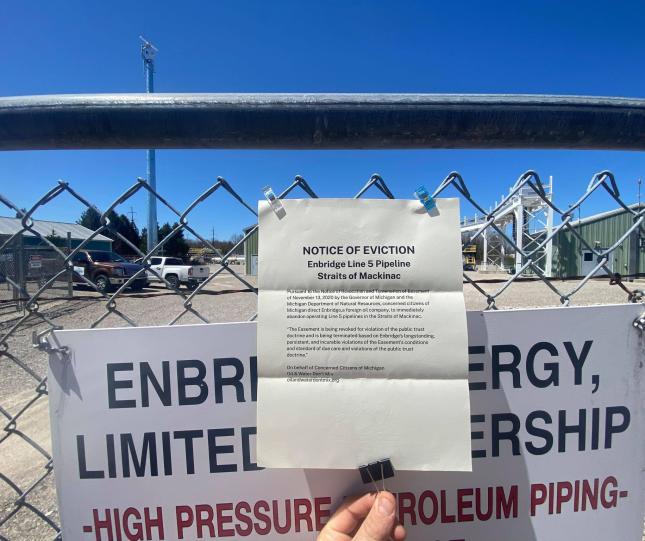 2021 Shut Down Line 5 Rally, Mackinaw City. Photo: Audrey Gerard Notice of Eviction hung on Enbridge fence