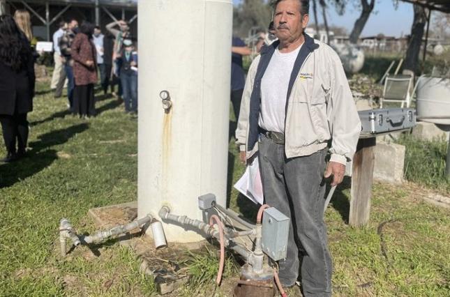 Community Water Tour in the San Joaquin Valley - Mr. Benitez next to his groundwater well Community Water Tour in the San Joaquin Valley - Mr. Benitez next to his groundwater well
