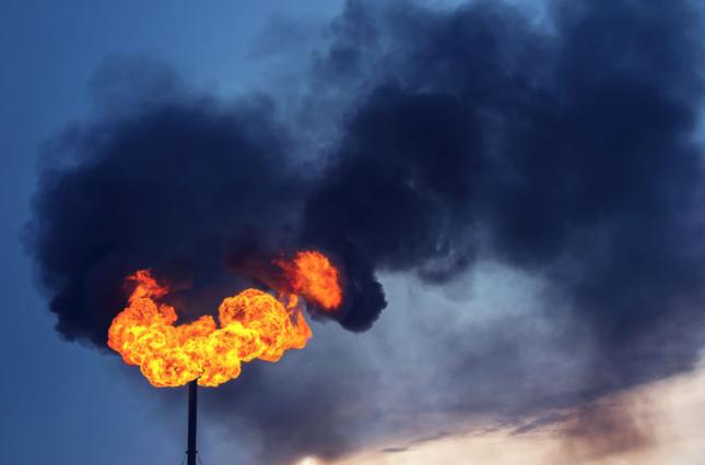 Methane flare, black smoke. Photo credit: Leonid Ikan / Shutterstock