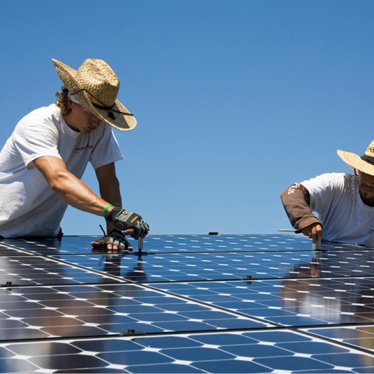 Solar workers installing panels Solar workers installing panels