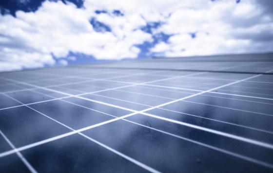 Solar panels, blue sky. Photo credit: epicurean / iStock