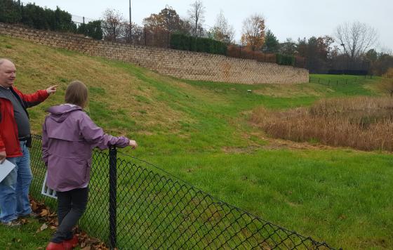 Richard and Jennifer look at a failing infiltration basin